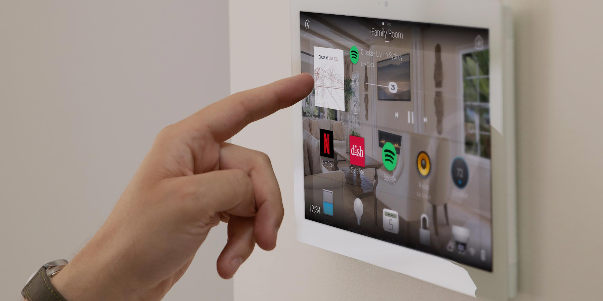 Hand touching a smart home control panel with various automation options