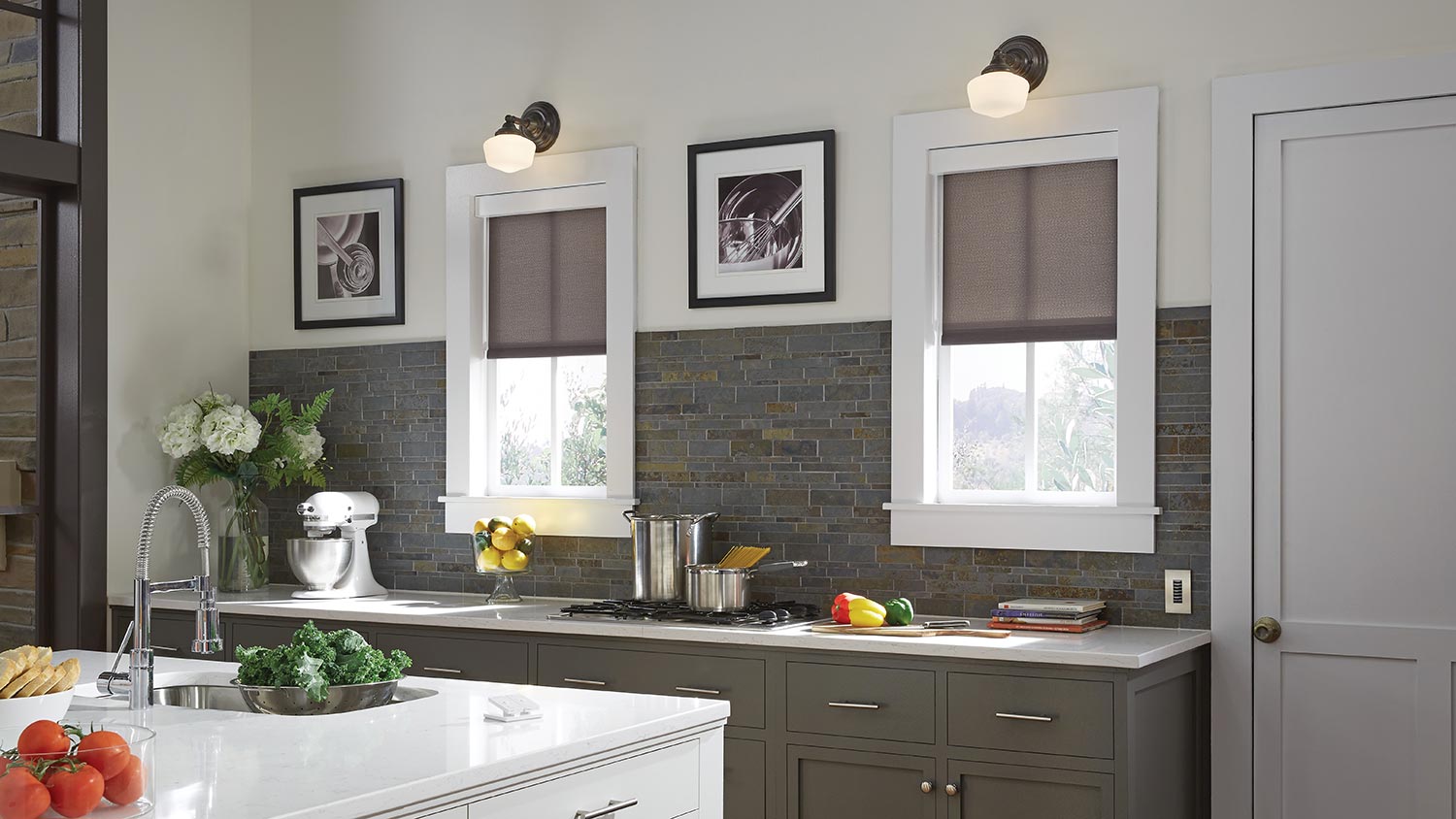 Kitchen with automated window shades and under-cabinet lighting