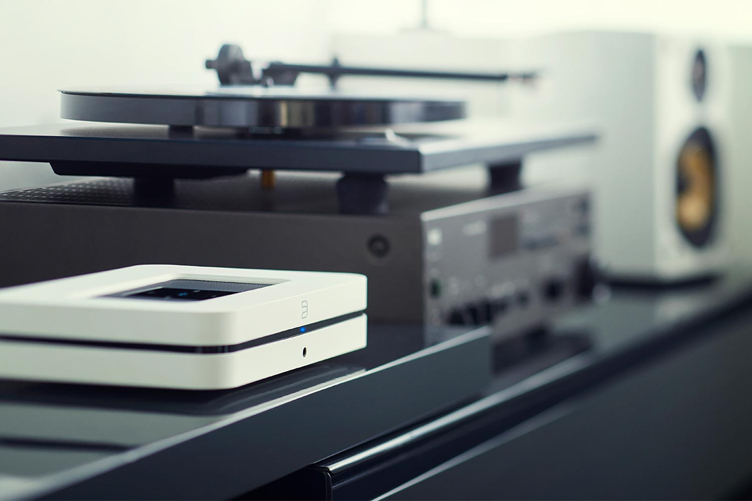 Close-up of audio equipment with a turntable and speakers