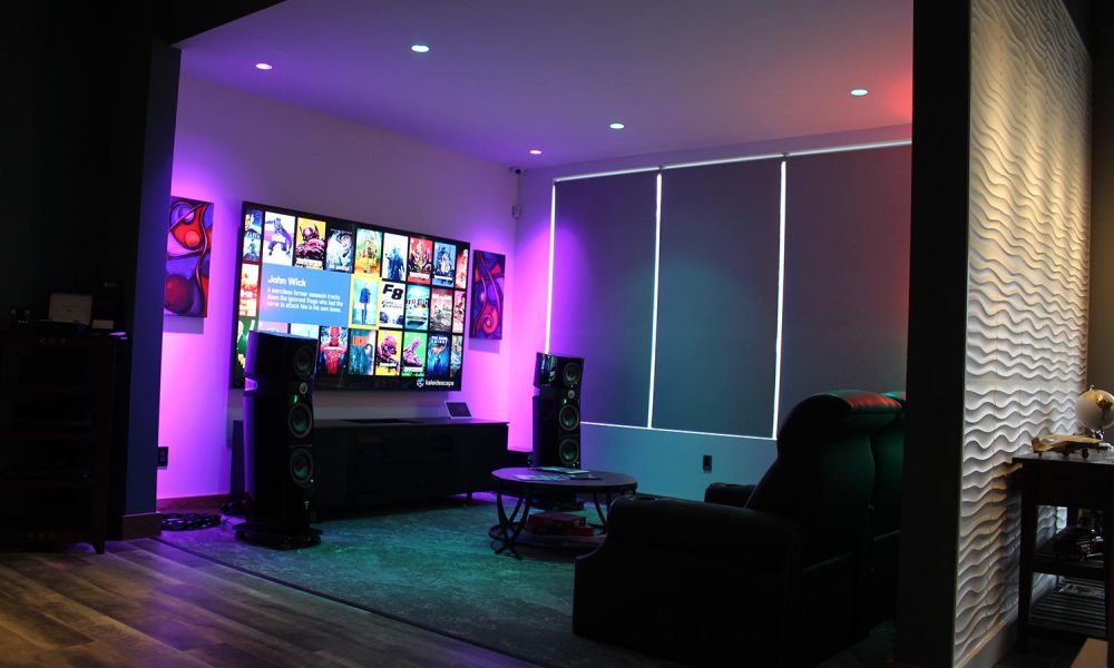 Theater room with vibrant purple lighting and multiple movie posters