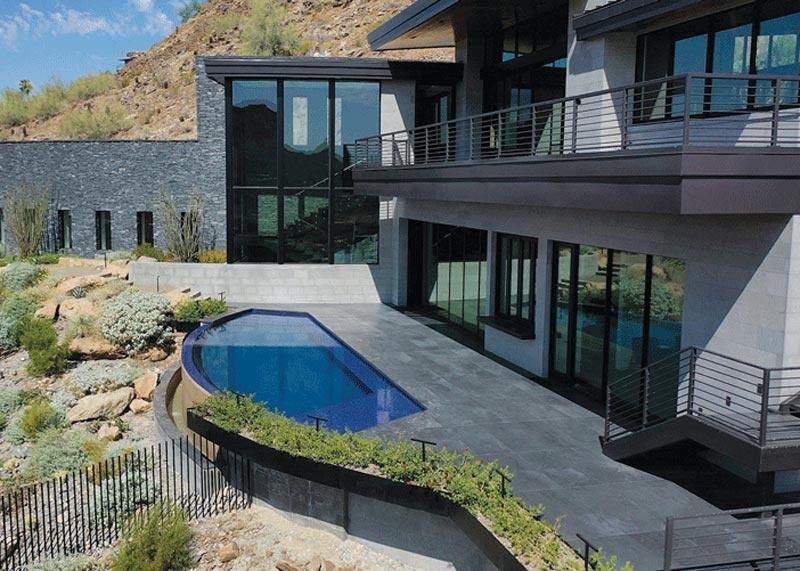 Luxury hillside home with a sleek infinity pool and scenic views