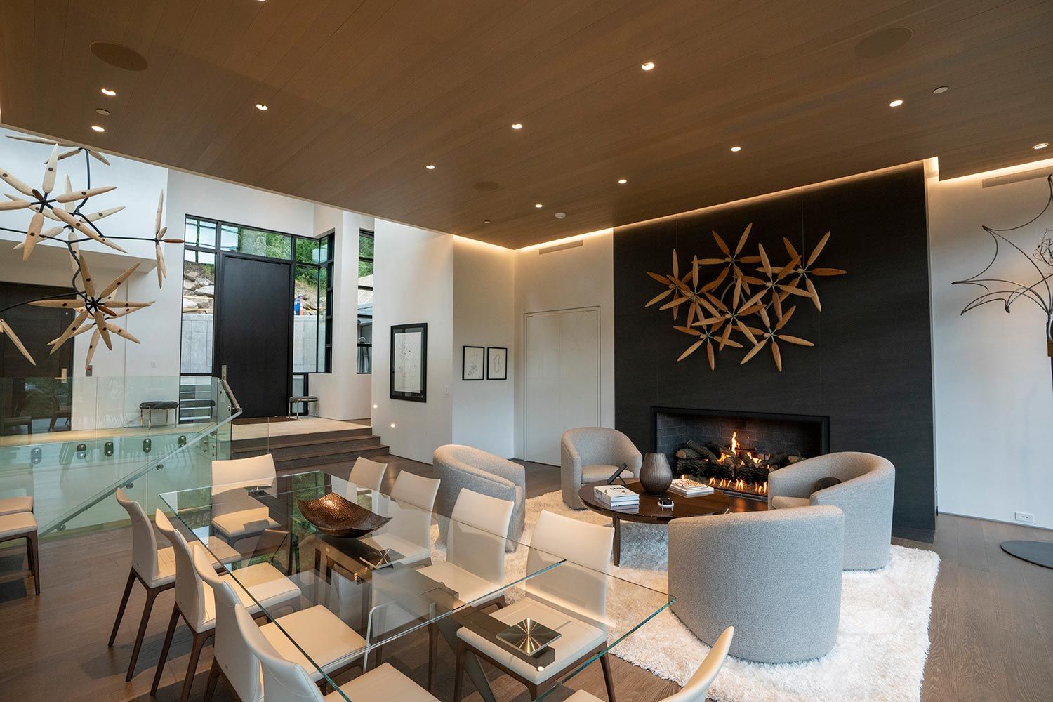 Elegant dining and living area with modern lighting