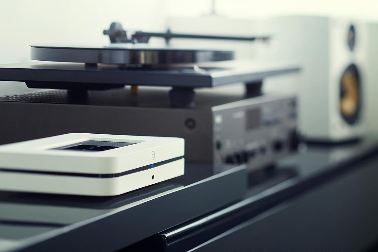 Close-up of audio equipment with a turntable and speakers