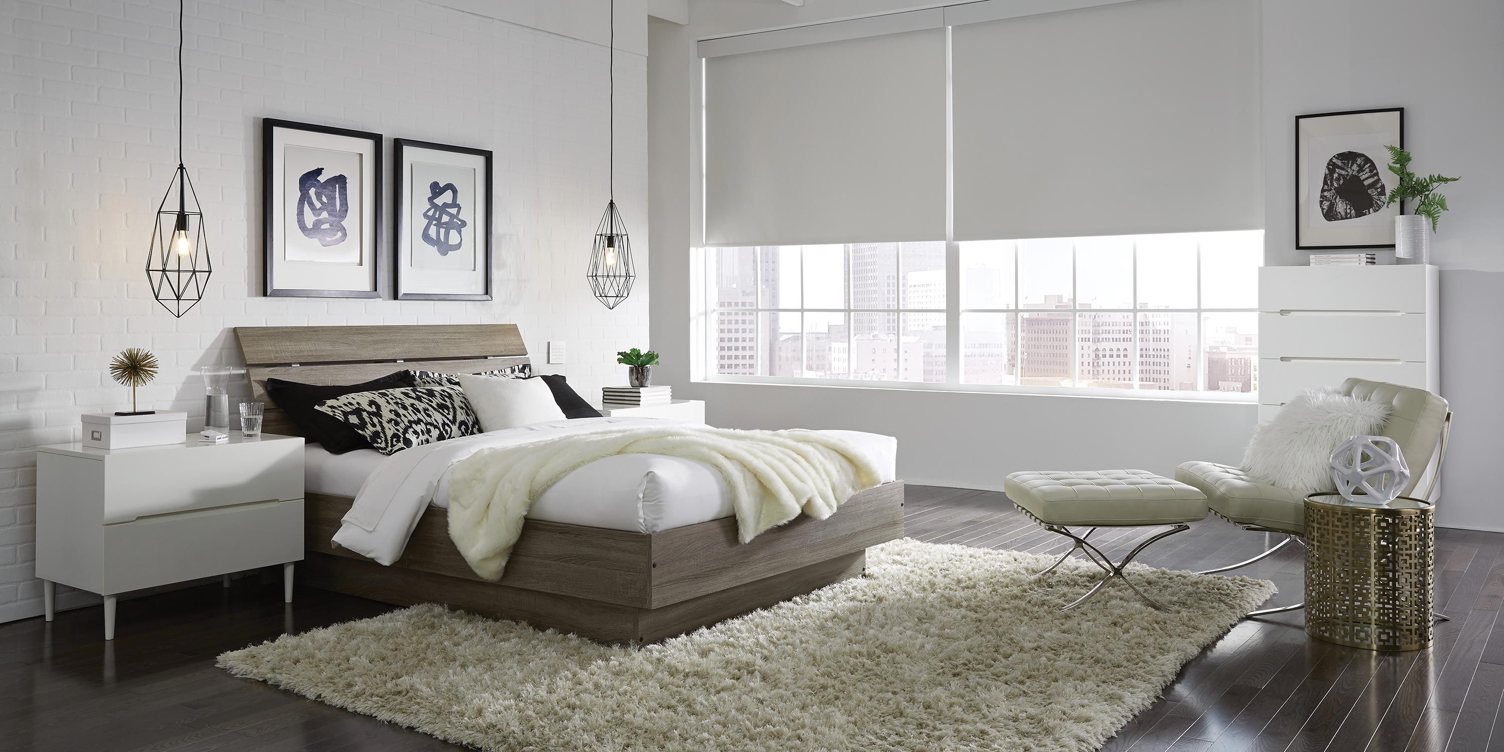 Stylish bedroom with large windows and cozy decor