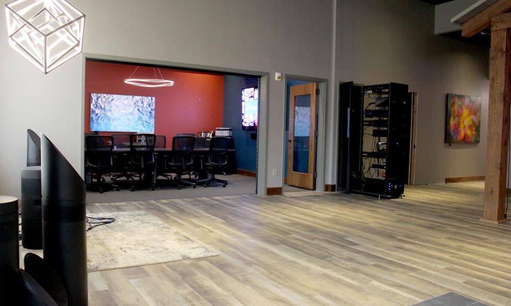 View of conference room from showroom floor with large glowing cube light